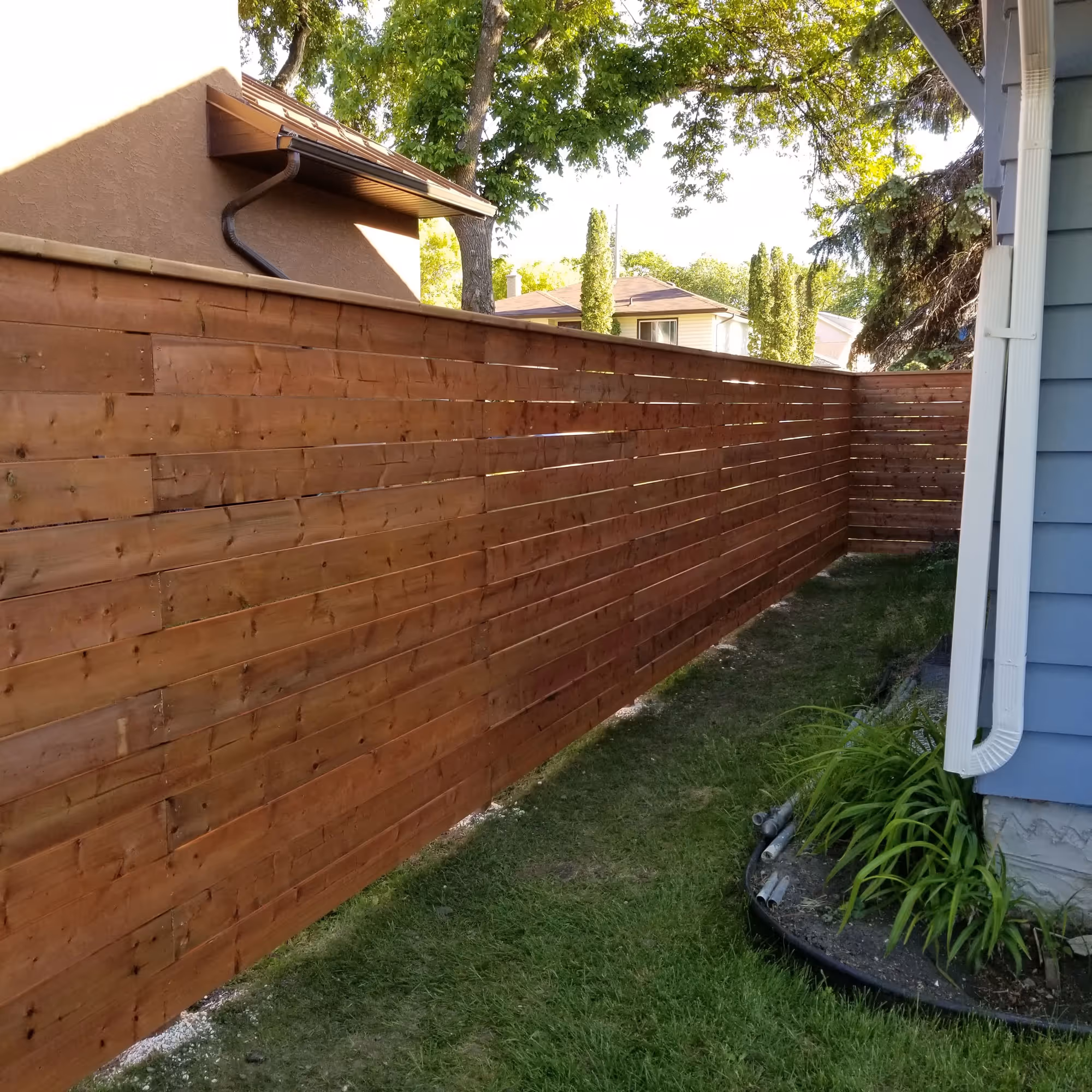 A new fence installation for a Winnipeg home.