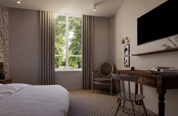 Chambre lumineuse avec vue sur le parc à l’Hôtel Source du Parc