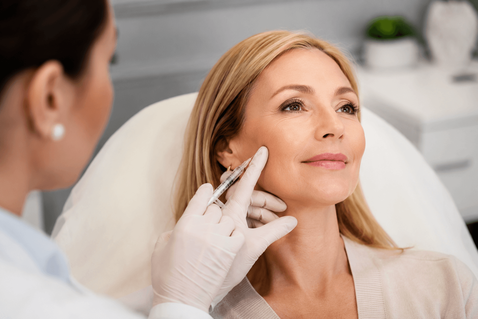 Provider performing Radiesse injectable treatment on a patient’s face to improve sagging skin and restore youthful volume in Las Vegas, Nevada