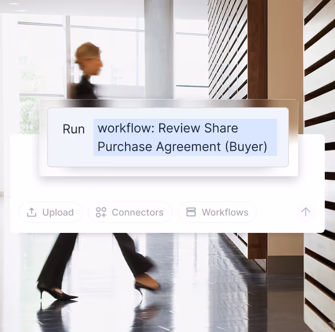 Blurred image of a person walking in a modern office with a digital overlay showing a workflow labeled 'Review Share Purchase Agreement (Buyer)'.