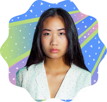 Portrait of a young Asian woman with long black hair wearing a white blouse, set against a colorful abstract background with triangles and stripes.
