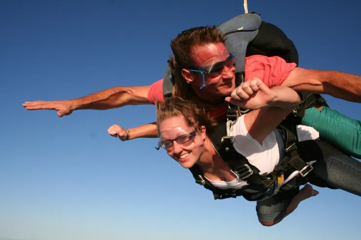 Tandem freefall with the Gulf Coast shoreline below near Port Aransas, Texas