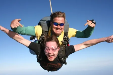 Tandem skydive freefall high above Mustang Island