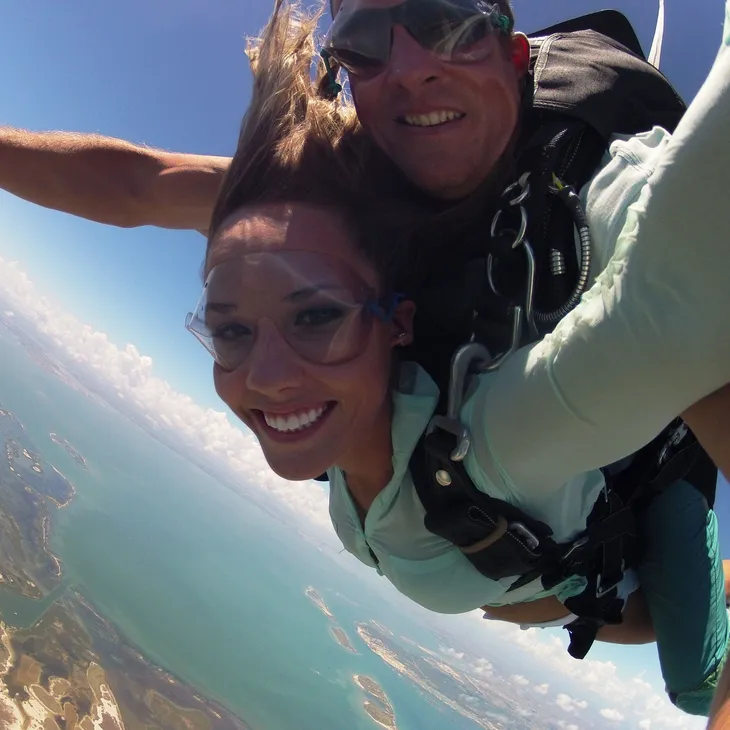Tandem skydiving selfie with the Mustang Island coastline behind