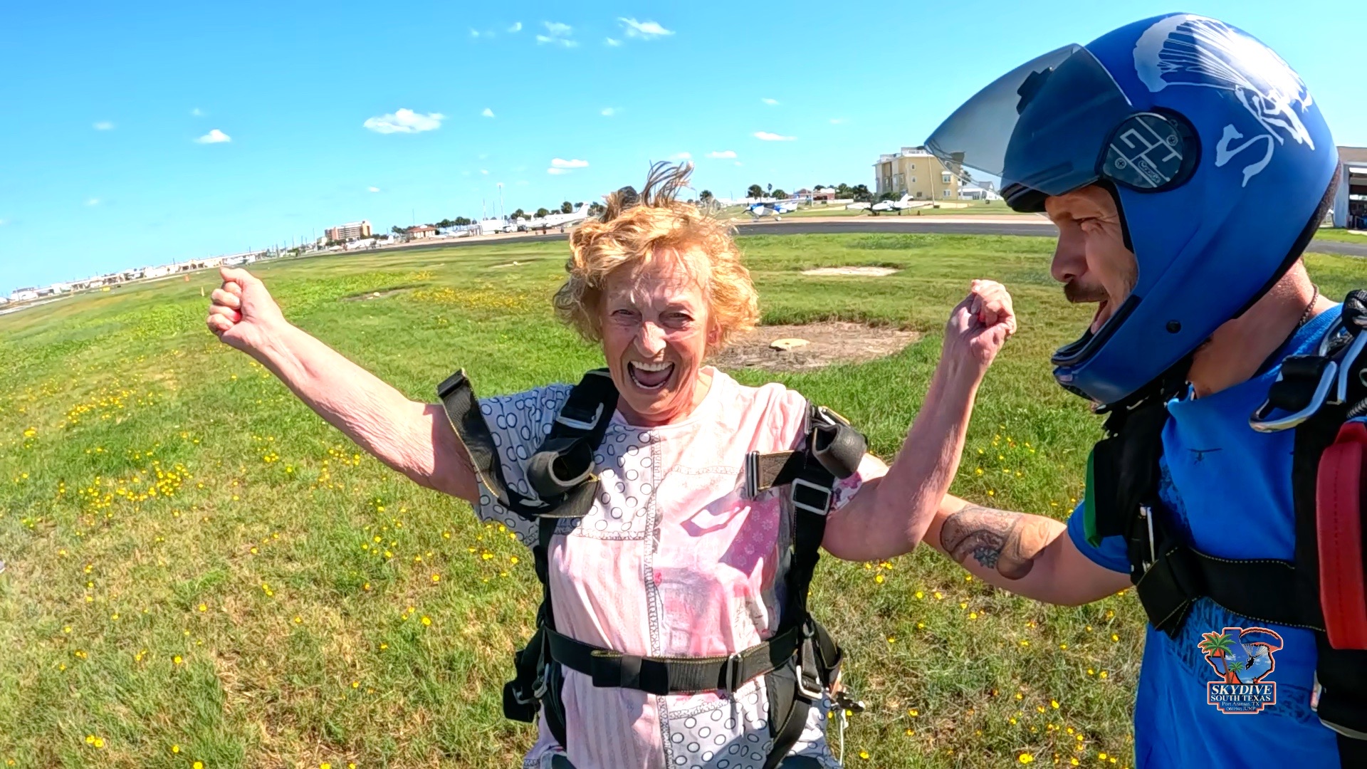 Skydiver celebrating after a beach landing in Port Aransas, Texas