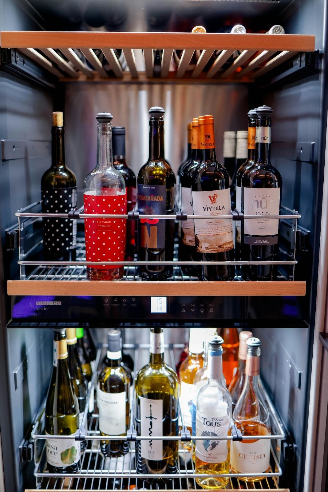 Different wine bottles in a fridge