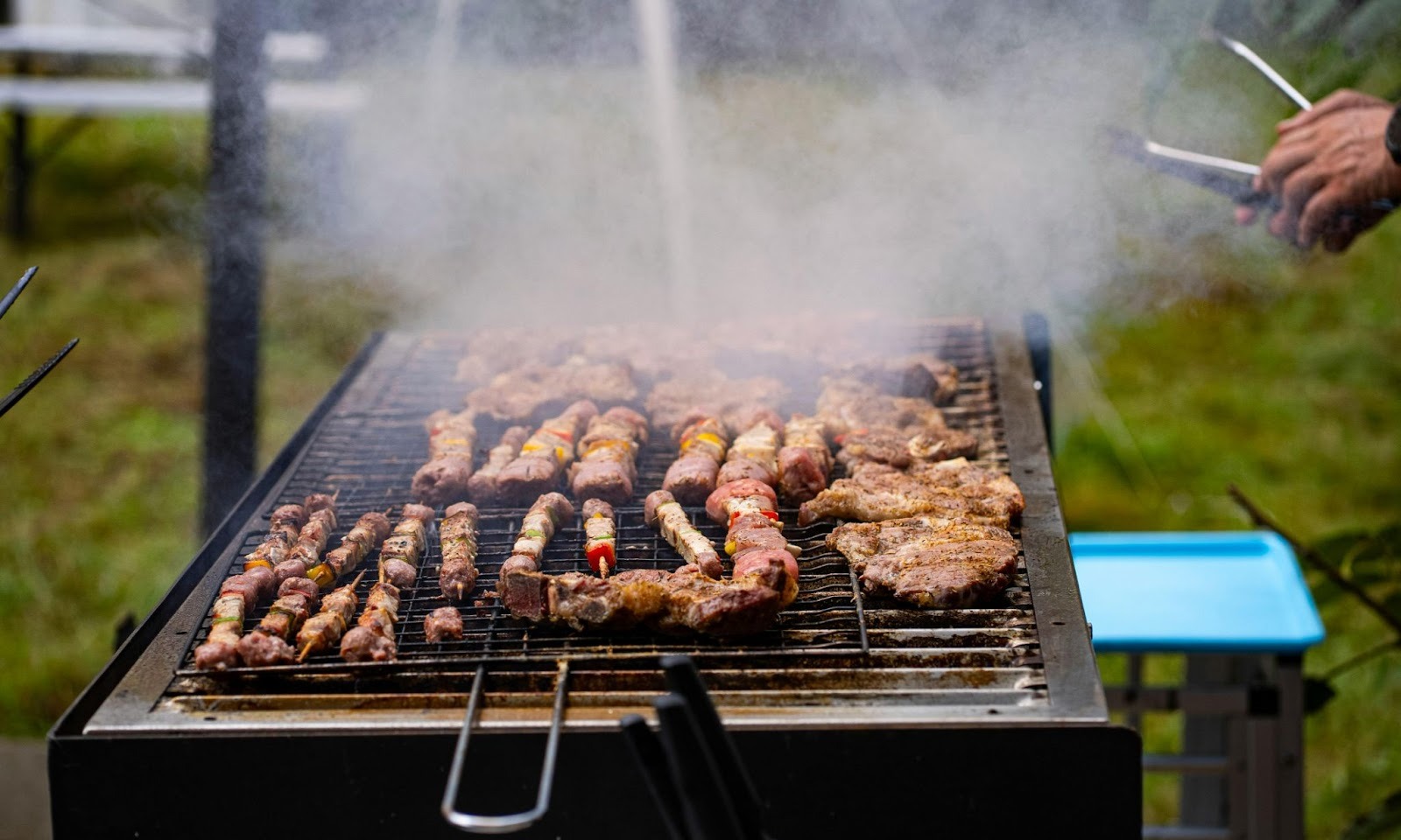 Steak grilling in backyard