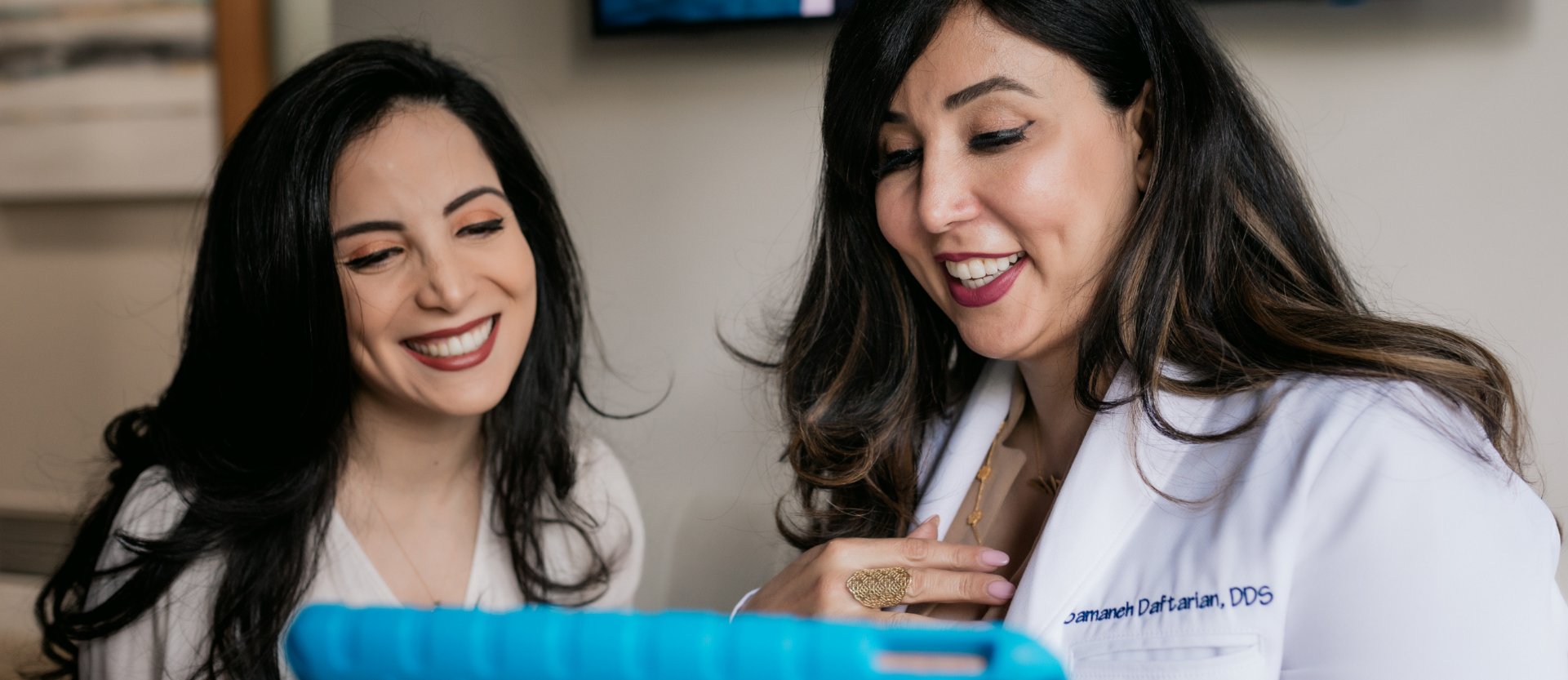 Dr. Daftarian talking to a female patient