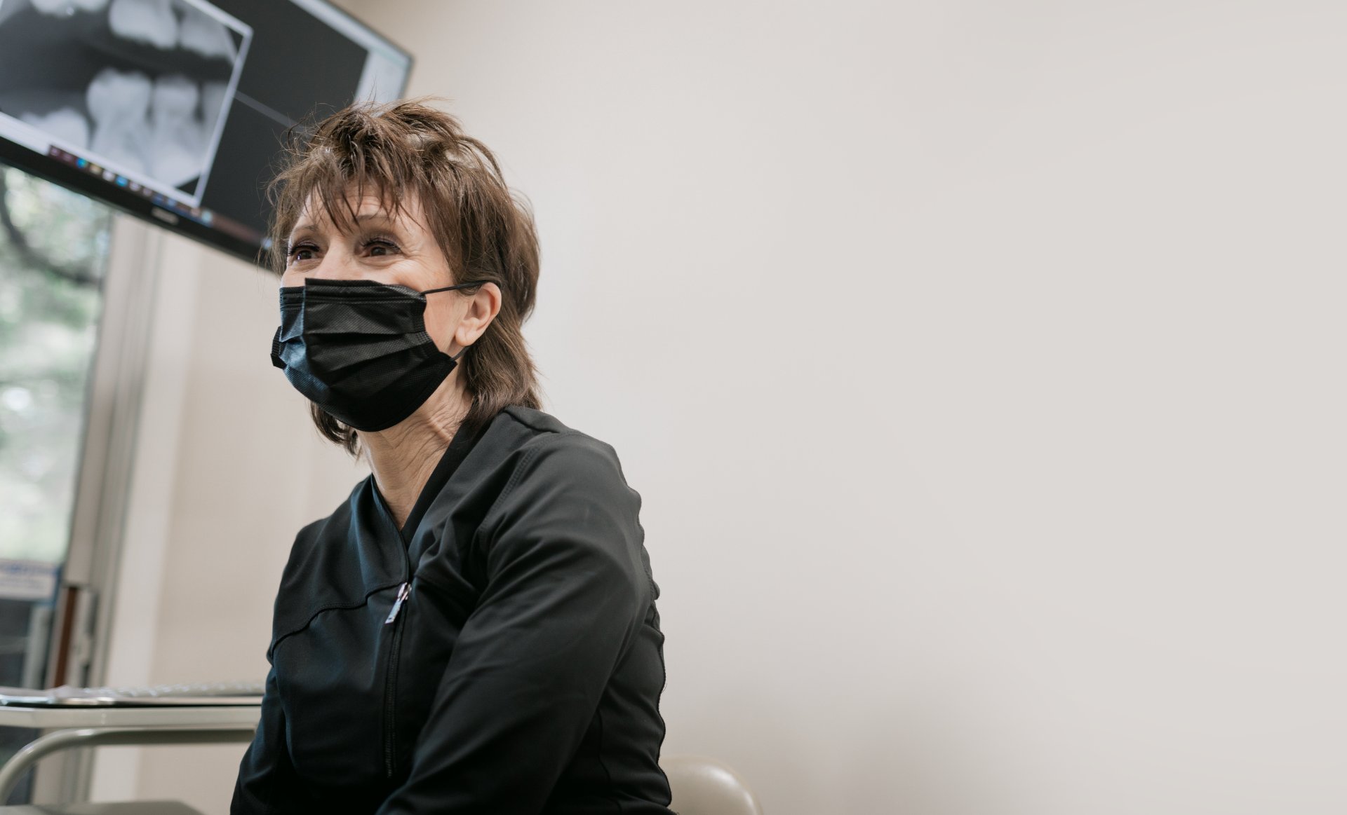 Hygienist speaking with a patient