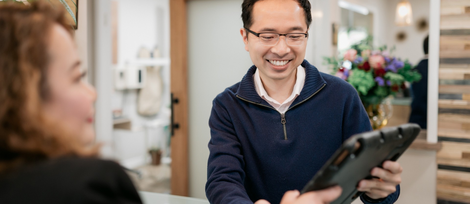 Male patient checking in for their appointment