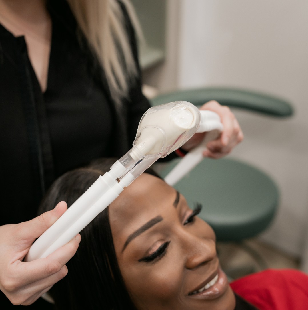 Hygienist prepping a patient for procedure