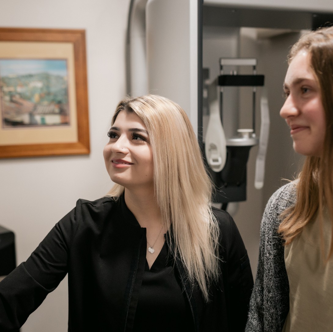 Hygienist and patient looking at the monitor
