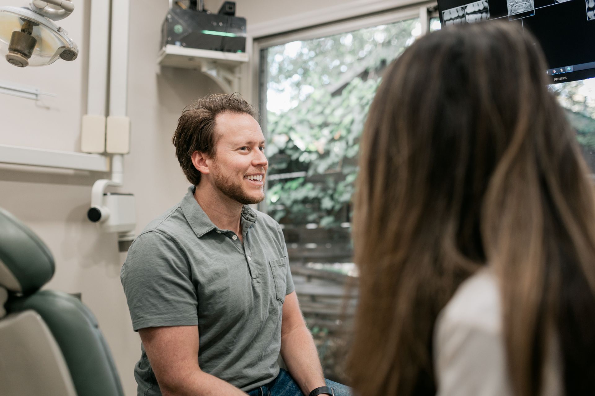 A patient looking at a dentist
