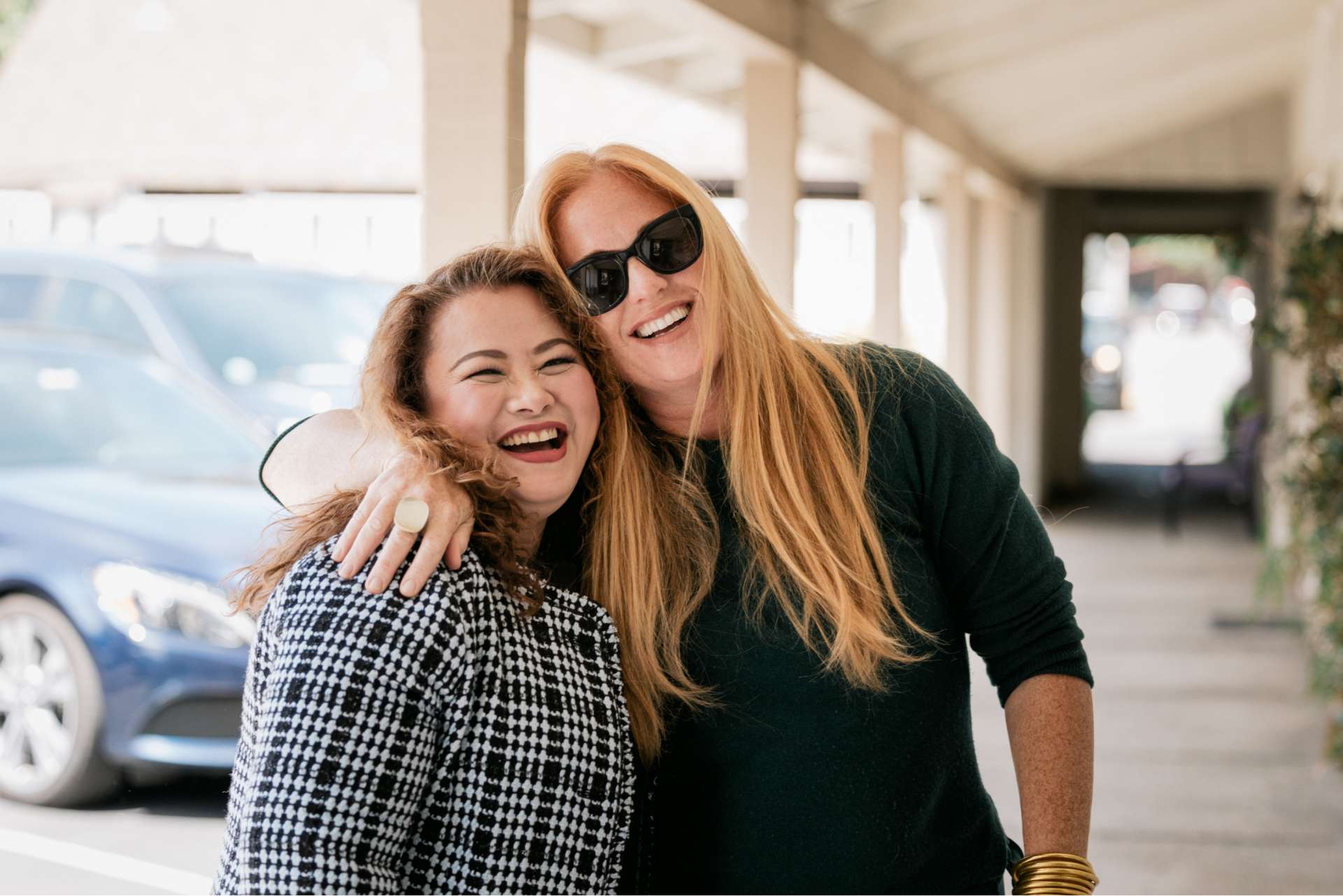 A team member puts her arm around a patient