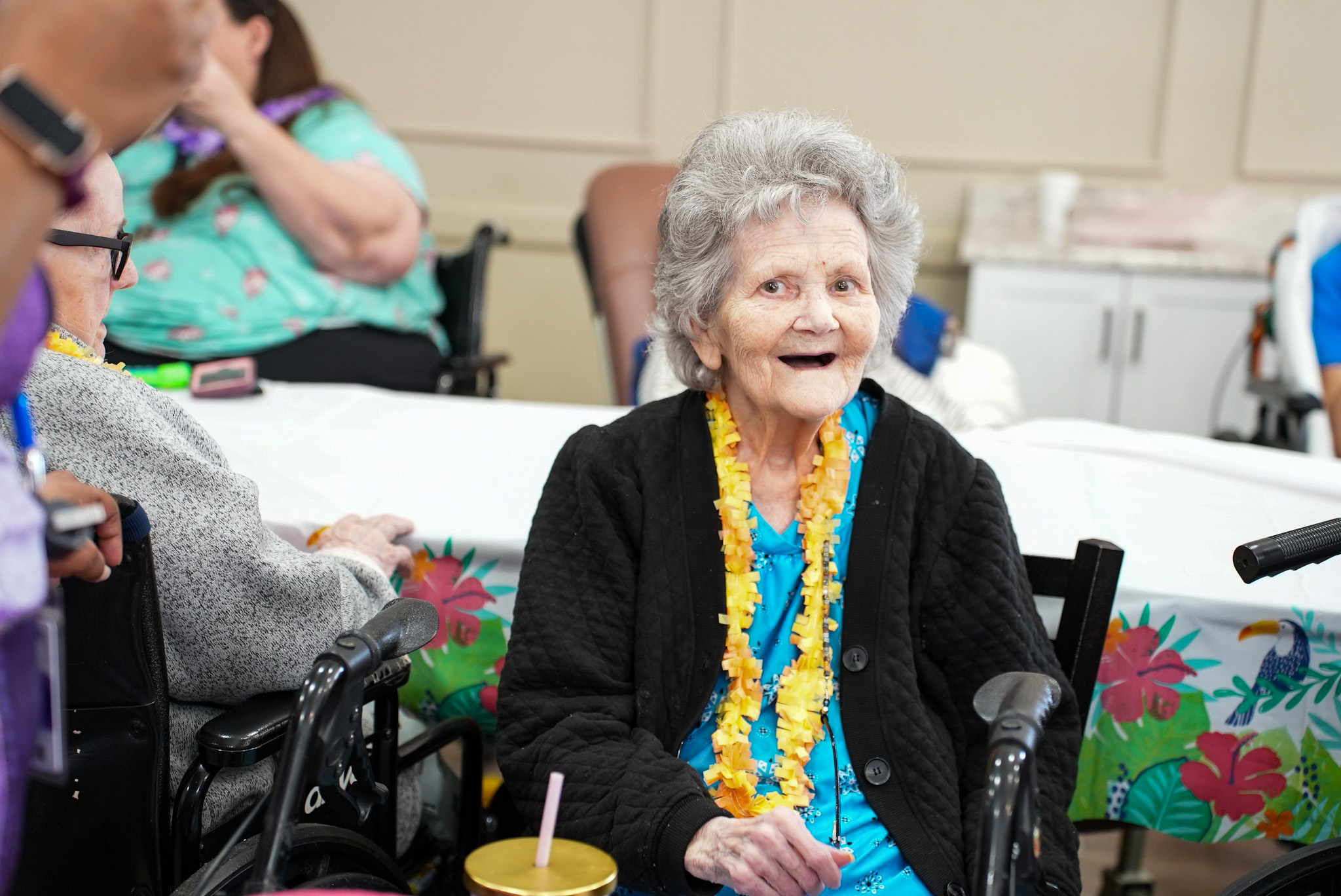 Lady dancing with a man in a wheelchair