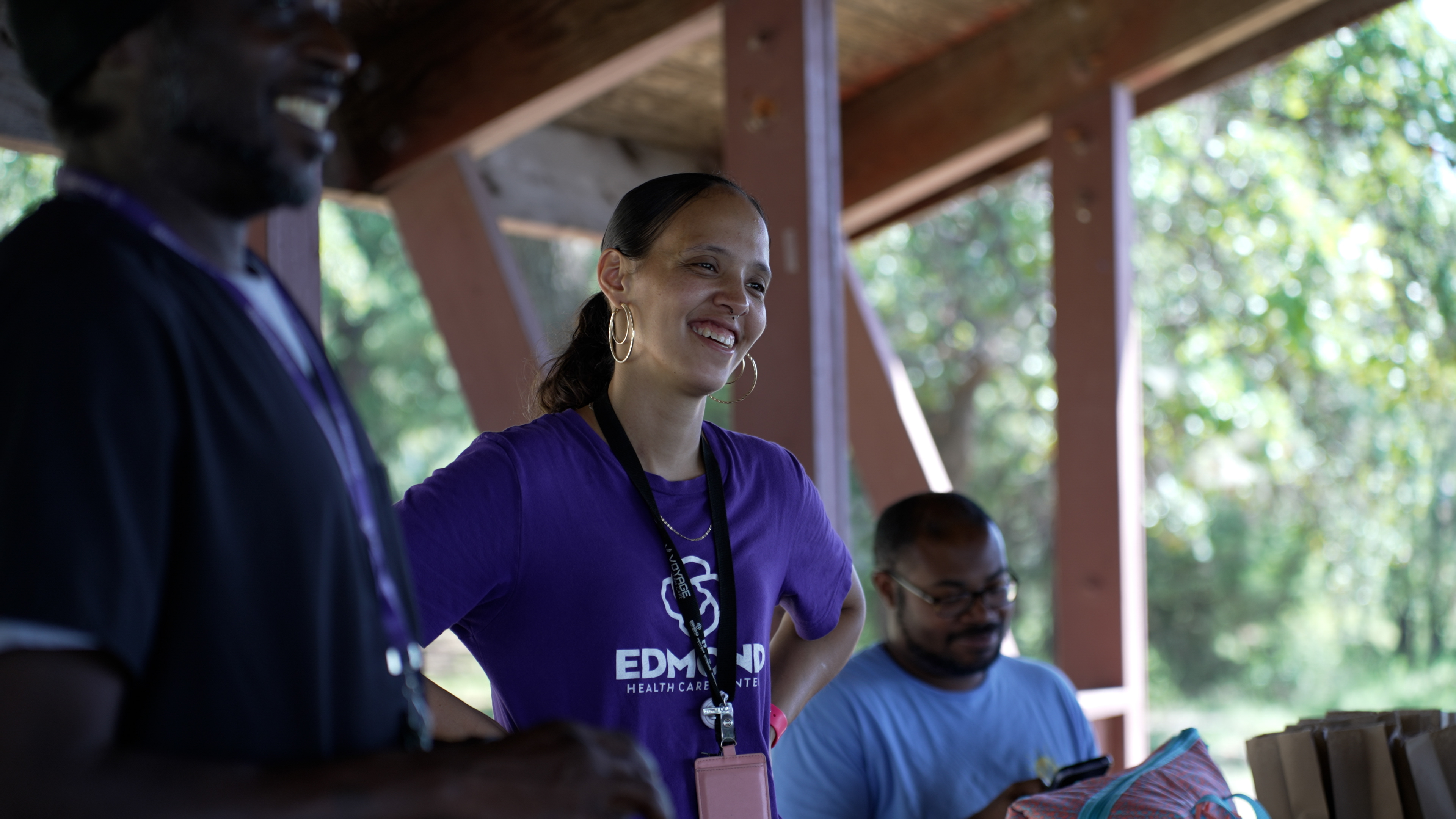 Two women smiling and fist bumping