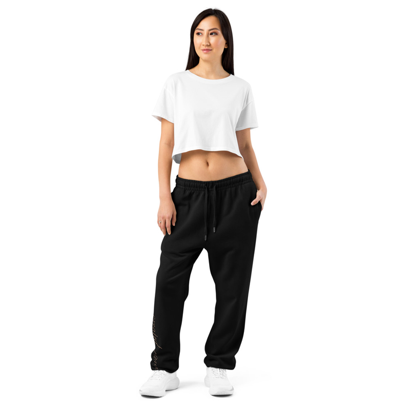 These heavyweight fleece sweatpants deliver comfort and structure with a relaxed fit. Designed for durability and daily wear, they feature secure zipped pockets and a smooth finish that elevates any casual look.

• 80% cotton, 20% recycled polyester
• Heavyweight fabric: 10 oz./yd² (340 g/m²)
• Relaxed fit with elastic waistband and cuffs
• Zipped side pockets for added security
• Metal-tipped drawcords
• Blank product sourced from Pakistan