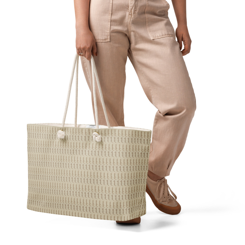 Big, bold, and ready to roam. This roomy tote features soft rope handles, a wrinkle-free finish, and plenty of space for your weekend essentials.

• 100% spun polyester exterior
• 50% cotton, 50% polyester cream sheeting interior lining
• Cream-colored cotton rope handles through metal grommets
• Size: 24″ × 13″ × 5.5″ (60.9 × 33 × 14 cm)
• Blank product sourced from China