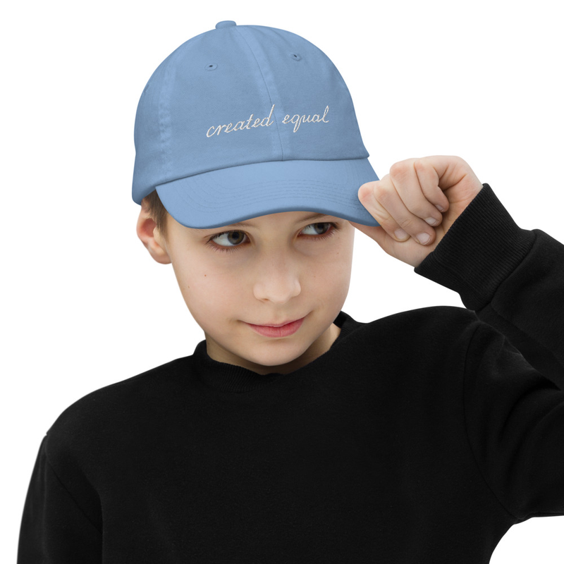 Good for a serious baseball training, as well as a rowdy backyard tumble, this youth baseball cap is sure to keep the sun out of your kid’s eyes. Featuring 6 eyelets for breathability and an adjustable strap, it offers a great fit, comfort, and a stylish design.

• 100% bio-washed chino cotton twill
• Head circumference: 21″–21.57″ (53.3 cm–54.8 cm)
• Unstructured, 6-panel, low-profile
• Pre-curved visor
• 6 embroidered eyelets
• Adjustable self-fabric hideaway strap closure
• Brass-toned tri-glide buckle
• Blank product sourced from Bangladesh