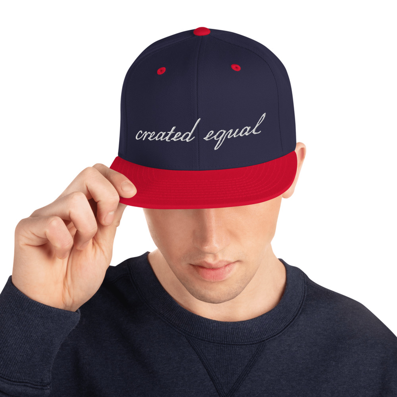 This hat is structured with a classic fit, flat brim, and full buckram. The adjustable snap closure makes it a comfortable, one-size-fits-most hat. 

• 80% acrylic, 20% wool
• Green Camo is 60% cotton, 40% polyester
• Structured, 6-panel, high-profile
• 6 embroidered eyelets
• Plastic snap closure
• Green undervisor
• Head circumference: 21⅝″–23⅝″ (54.9 cm–60 cm)
• Blank product sourced from Vietnam or Bangladesh