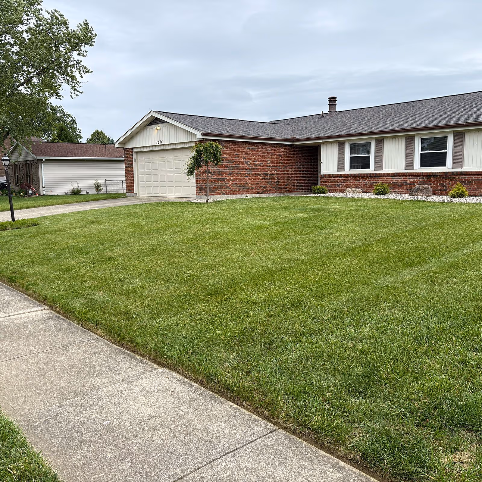 Sower’s Lawn Maintenance trimming lawn edges for a polished finish