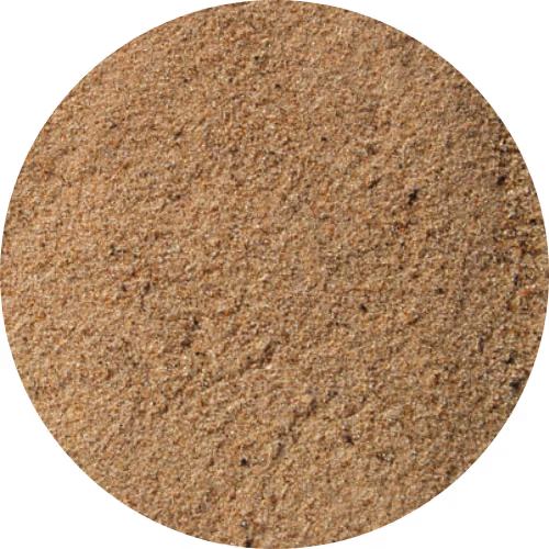 Close-up texture of fine, light brown play sand grains.