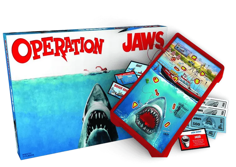 Board game Operation Jaws showing a shark with open mouth, game board with boats, money, and game cards.