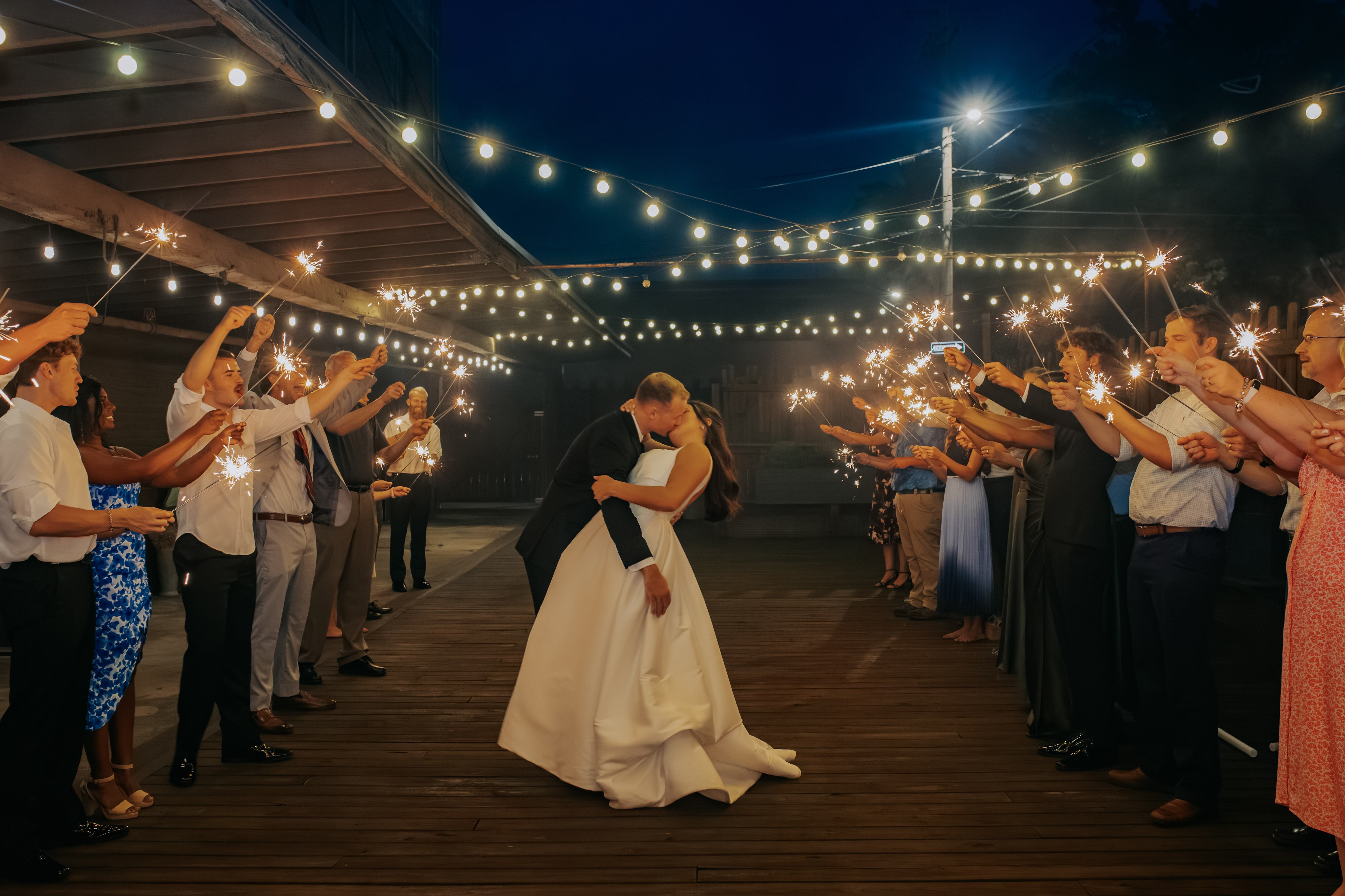 Evening celebration under string lights at The Venue at 939