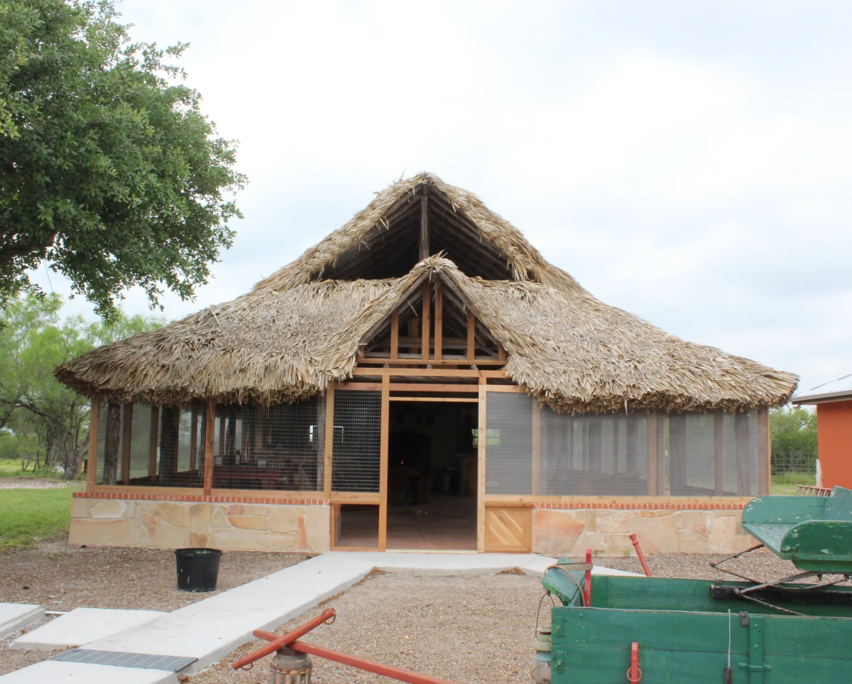 A covered palapa with a chimney
