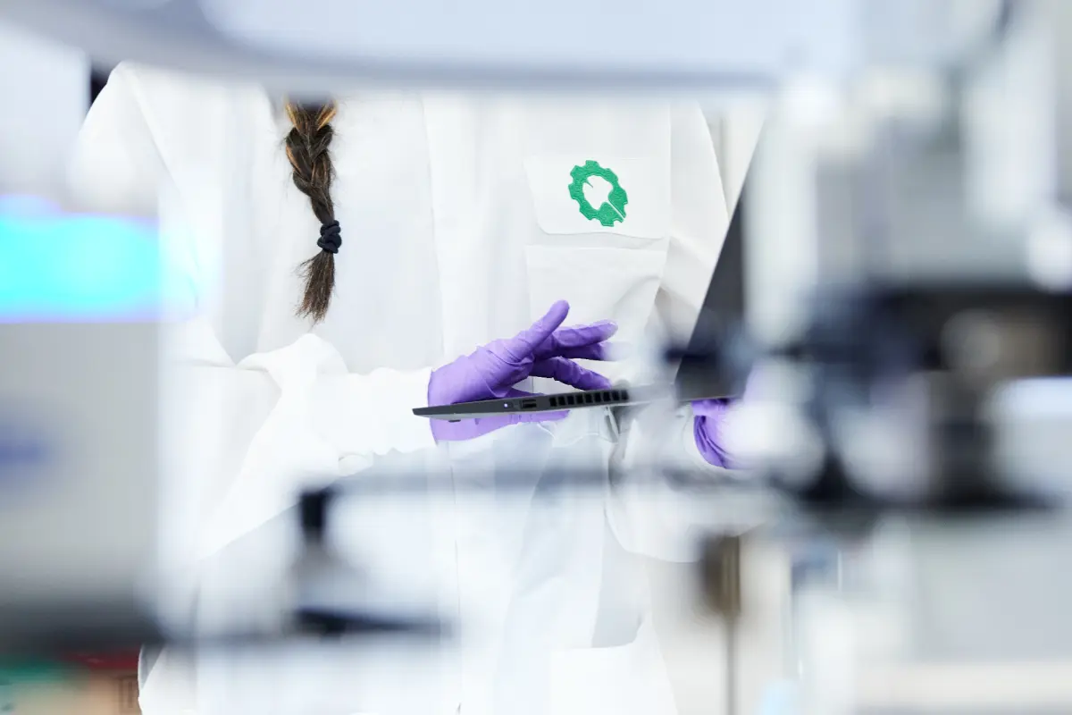 bioworker typing on computer in lab