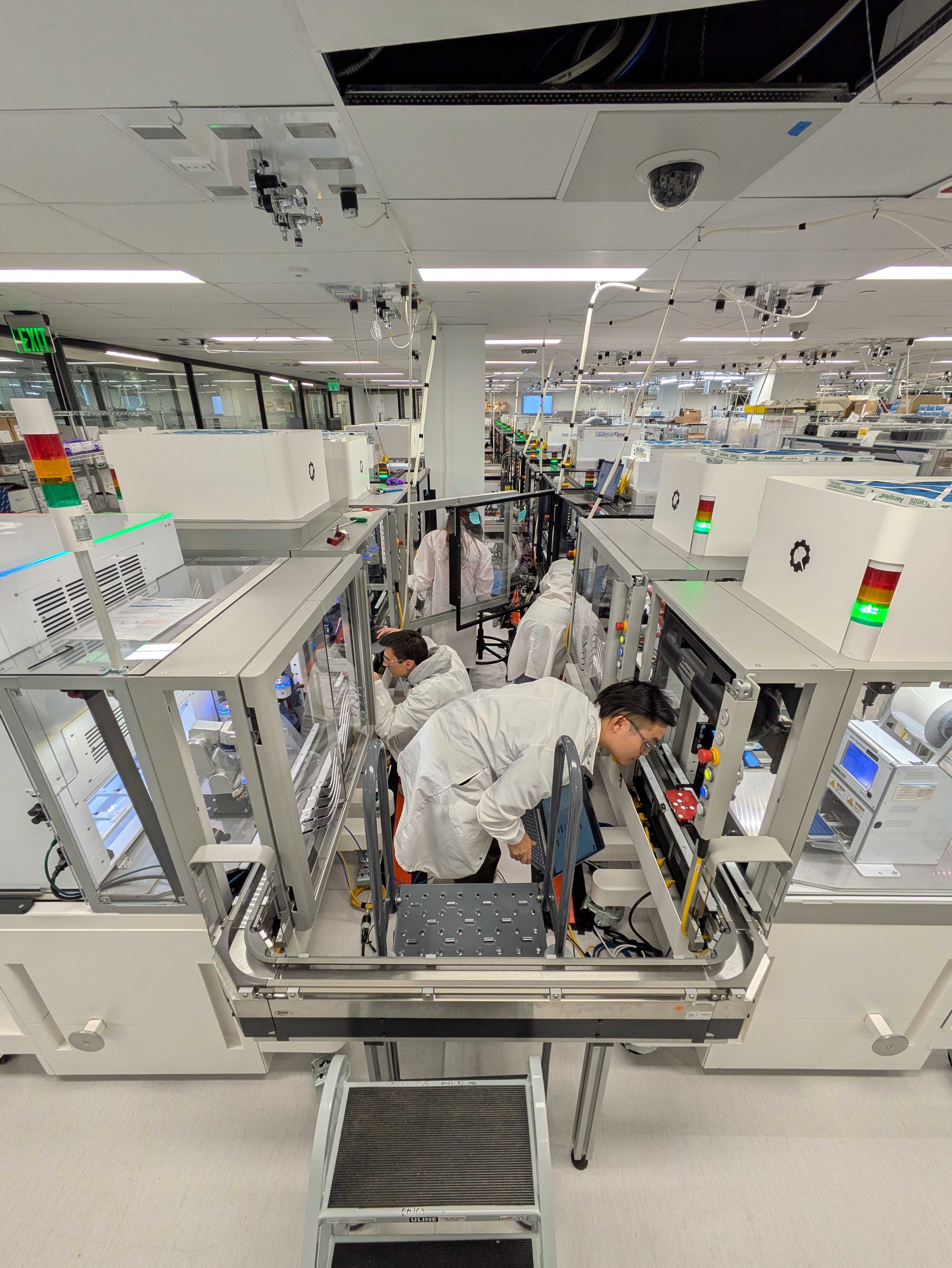 photo of bioworkers supporting RAC system in lab