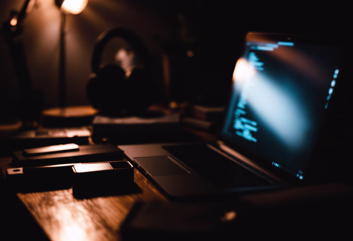 [background image] image of a desk with tech gadgets (for an ai developer tools)