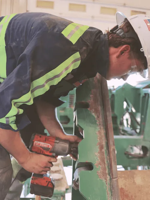 A man working on a piece of wood.