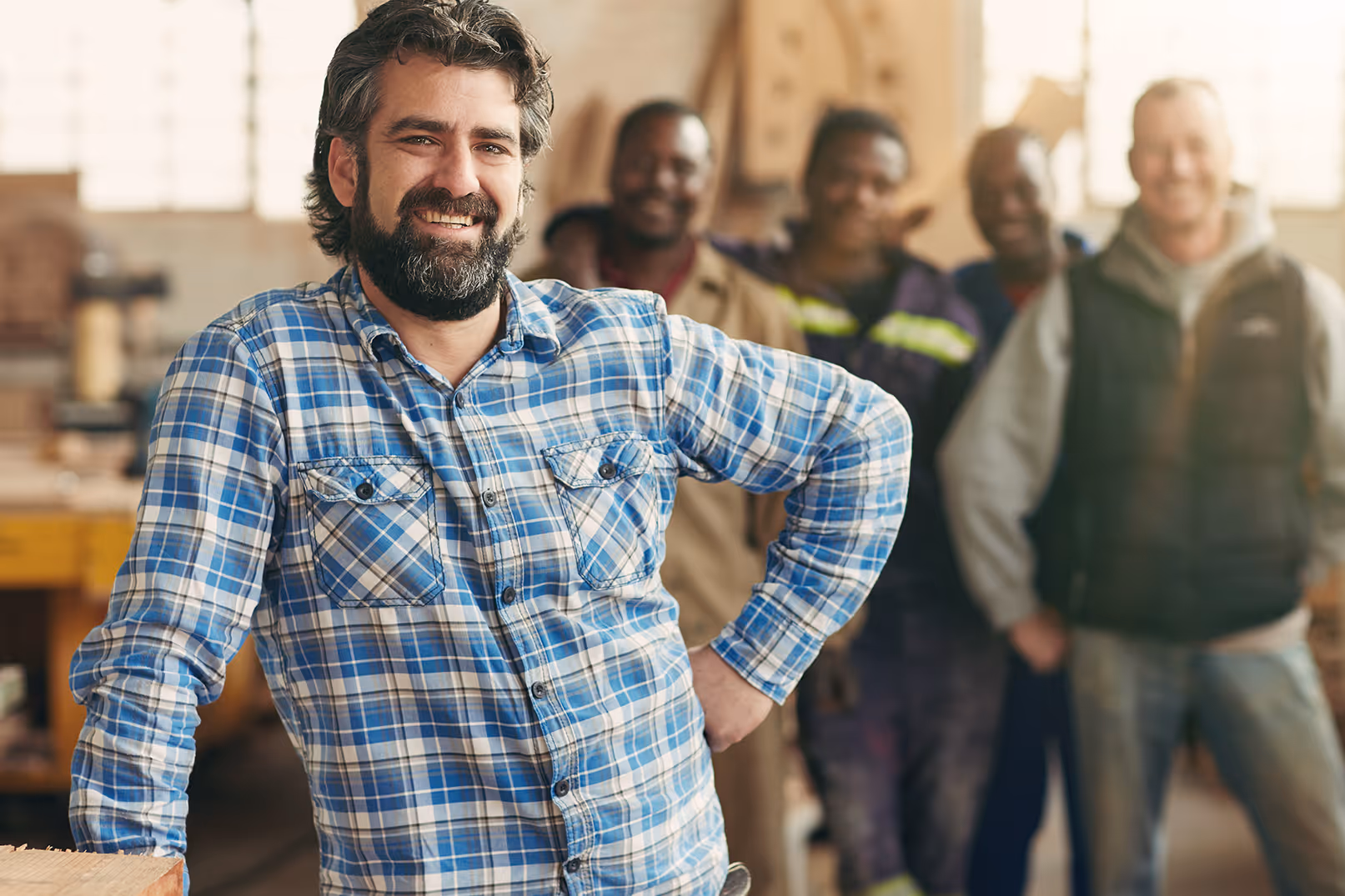 Happy business owner with his employees