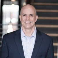 customer giving a testimonial for an ai biotech company [headshot]