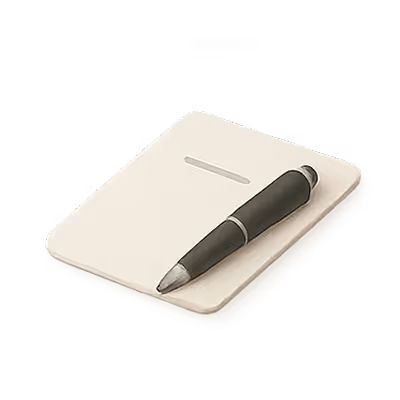 Black pen resting diagonally on a closed beige notebook.