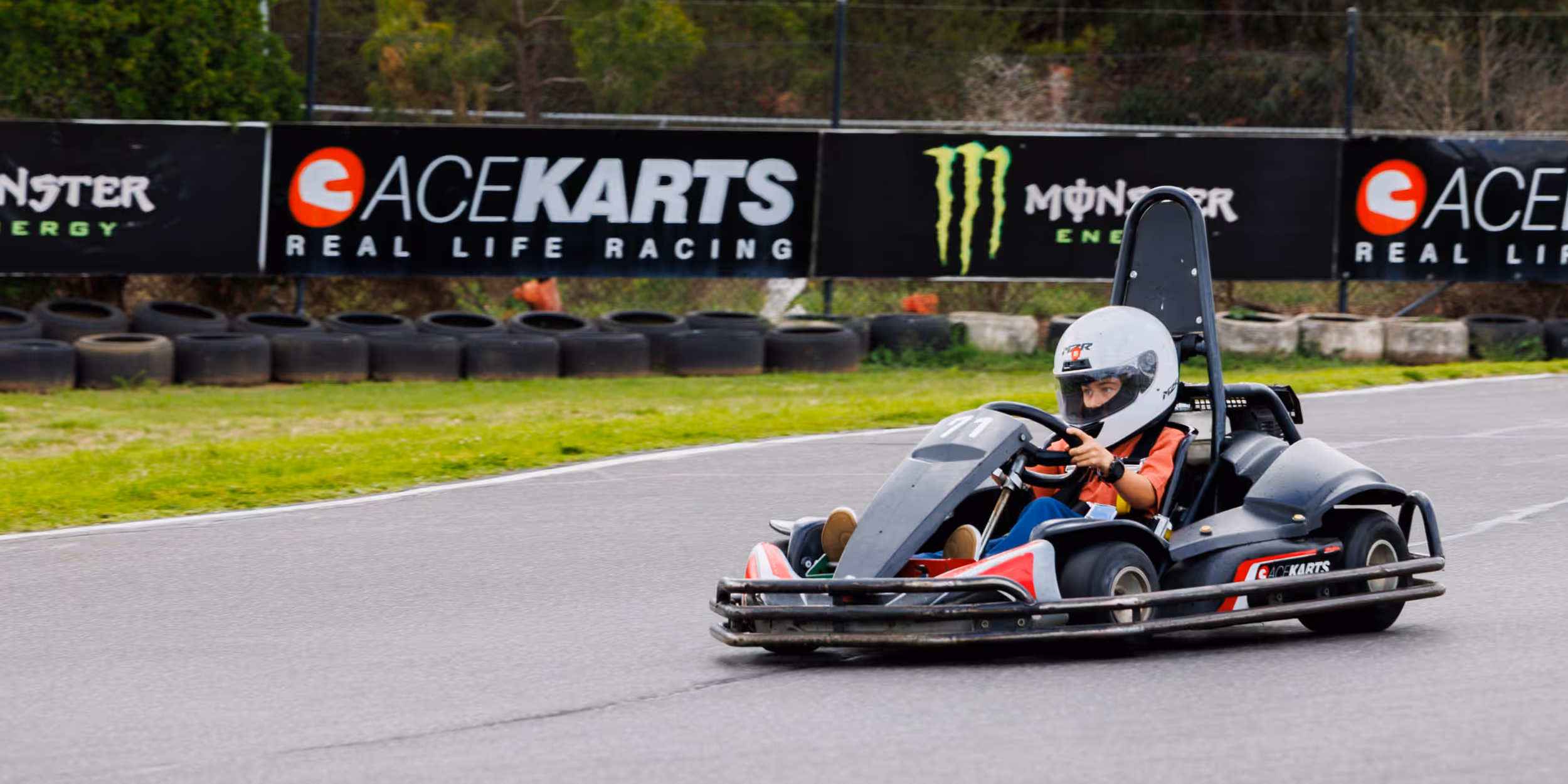 Red and black Ace Karts go-kart with number 76 on the front, photographed against a white background.