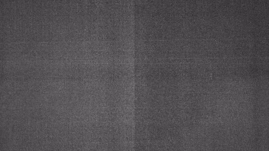 Dark gray textured background with subtle vertical and horizontal fold lines.