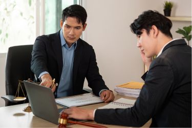 Two men working together strategizing