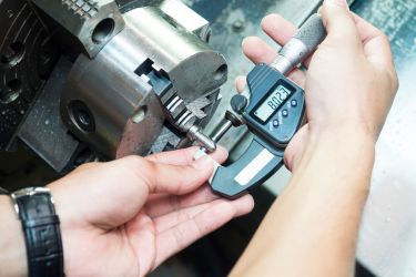 Using calipers to inspect size