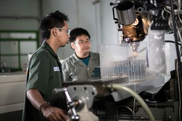 Men using an industrial machine