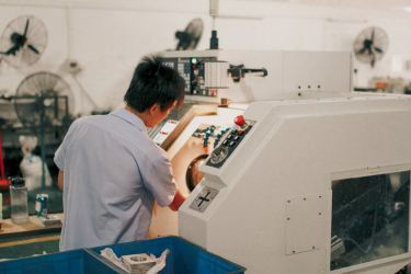 Man using an industrial machinery
