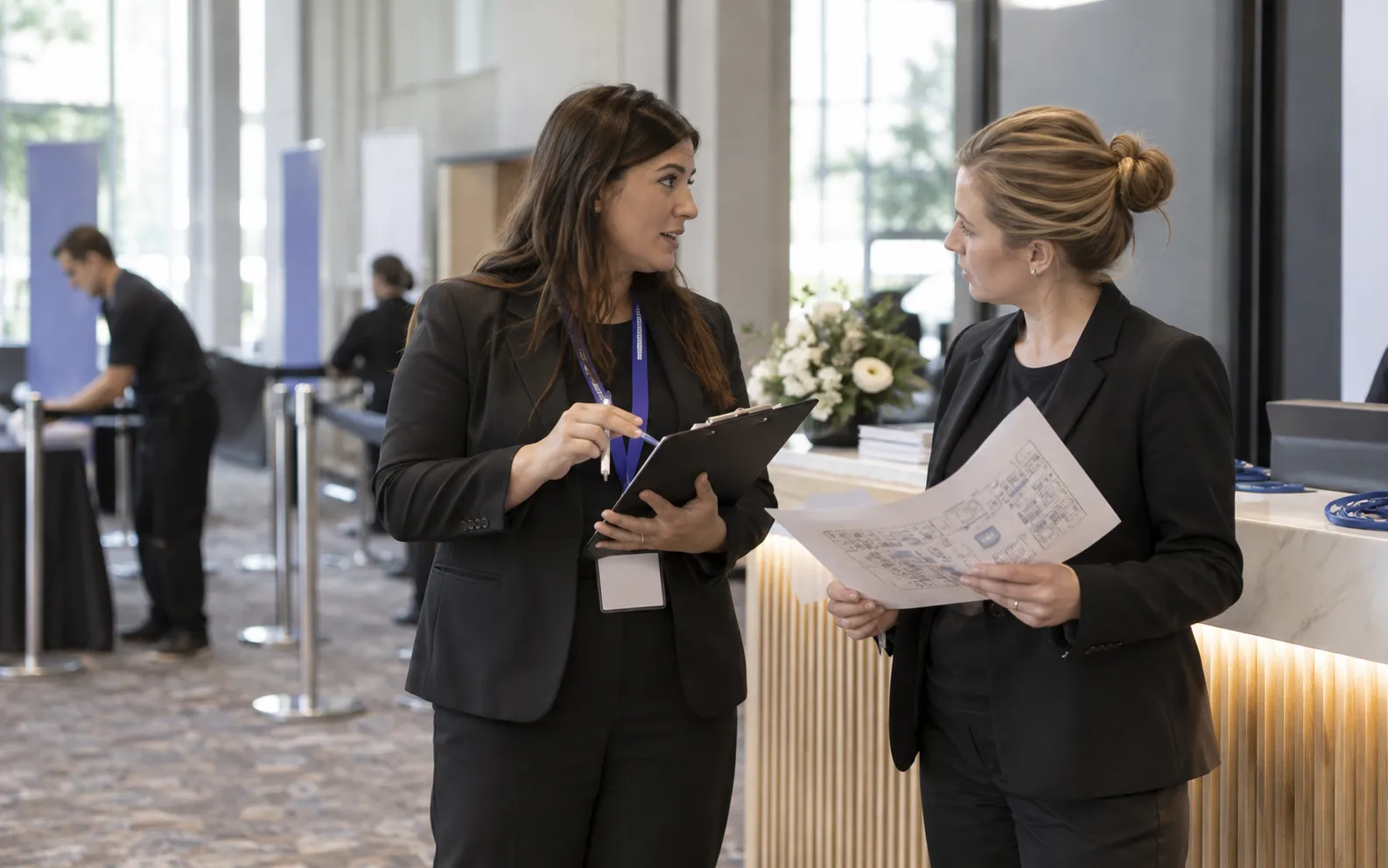 Generated scenario: A staffing account manager and venue coordinator discuss who will own onsite duties beside a reception desk before doors open