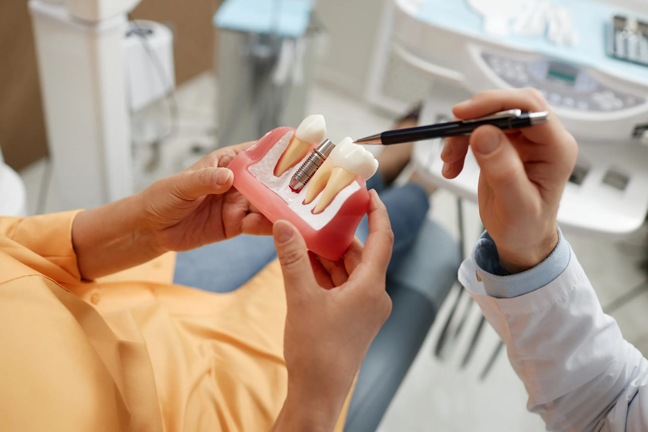 Patient learning what to expect at a dental implant consultation