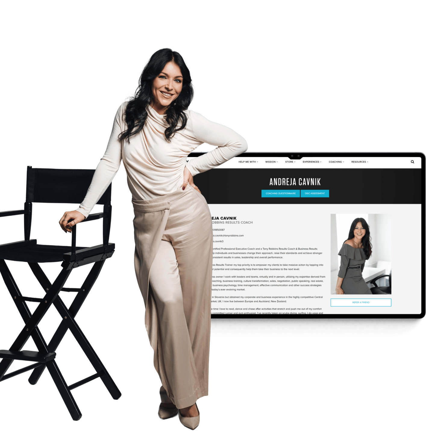 Woman with long dark hair wearing a cream blouse and beige pants leaning on a black director's chair, smiling with a website screenshot of Andreja Cavnik coaching profile in the background.
