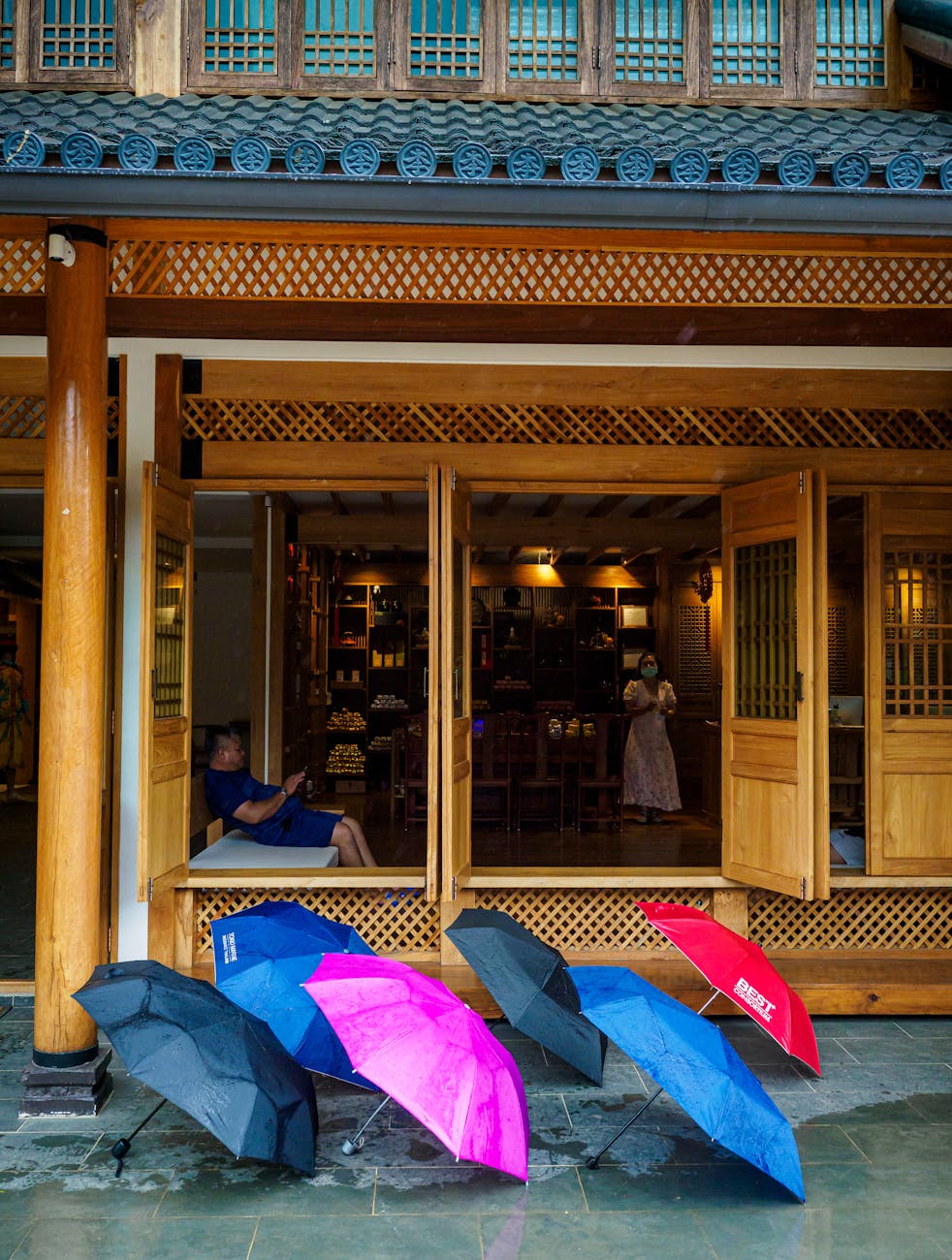 Vibrant umbrellas outside a traditional shop in Mae Hong Son, Thailand.