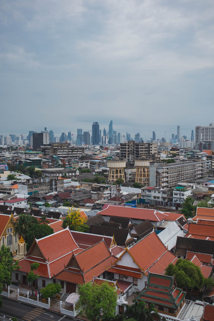 Vibrant mix of traditional and modern architecture in Bangkok cityscape.