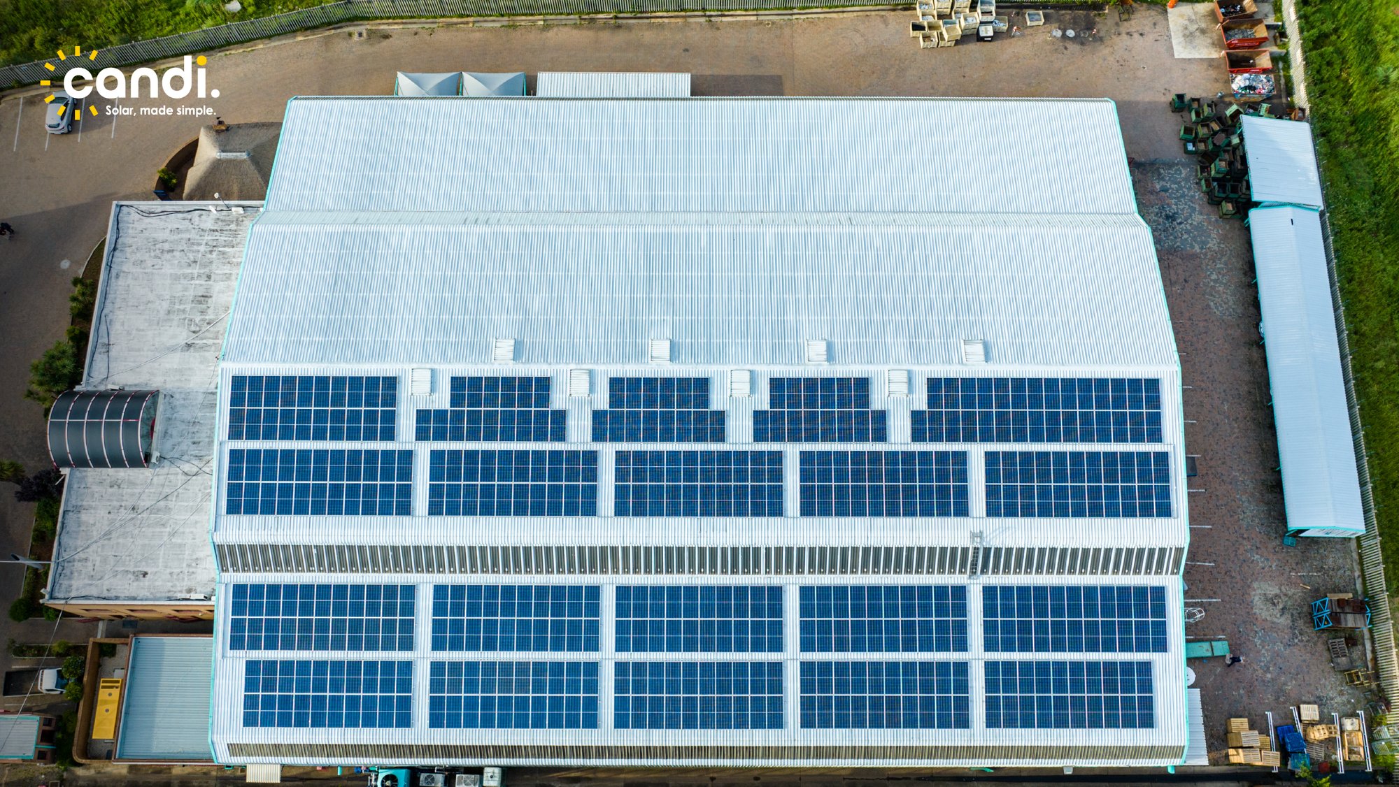 Close-up of a large commercial rooftop solar installation by Candi Solar in South Africa