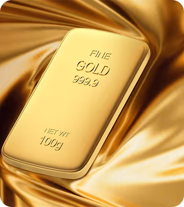 A 100 gram fine gold bar marked 999.9 purity resting on a shiny golden satin fabric.