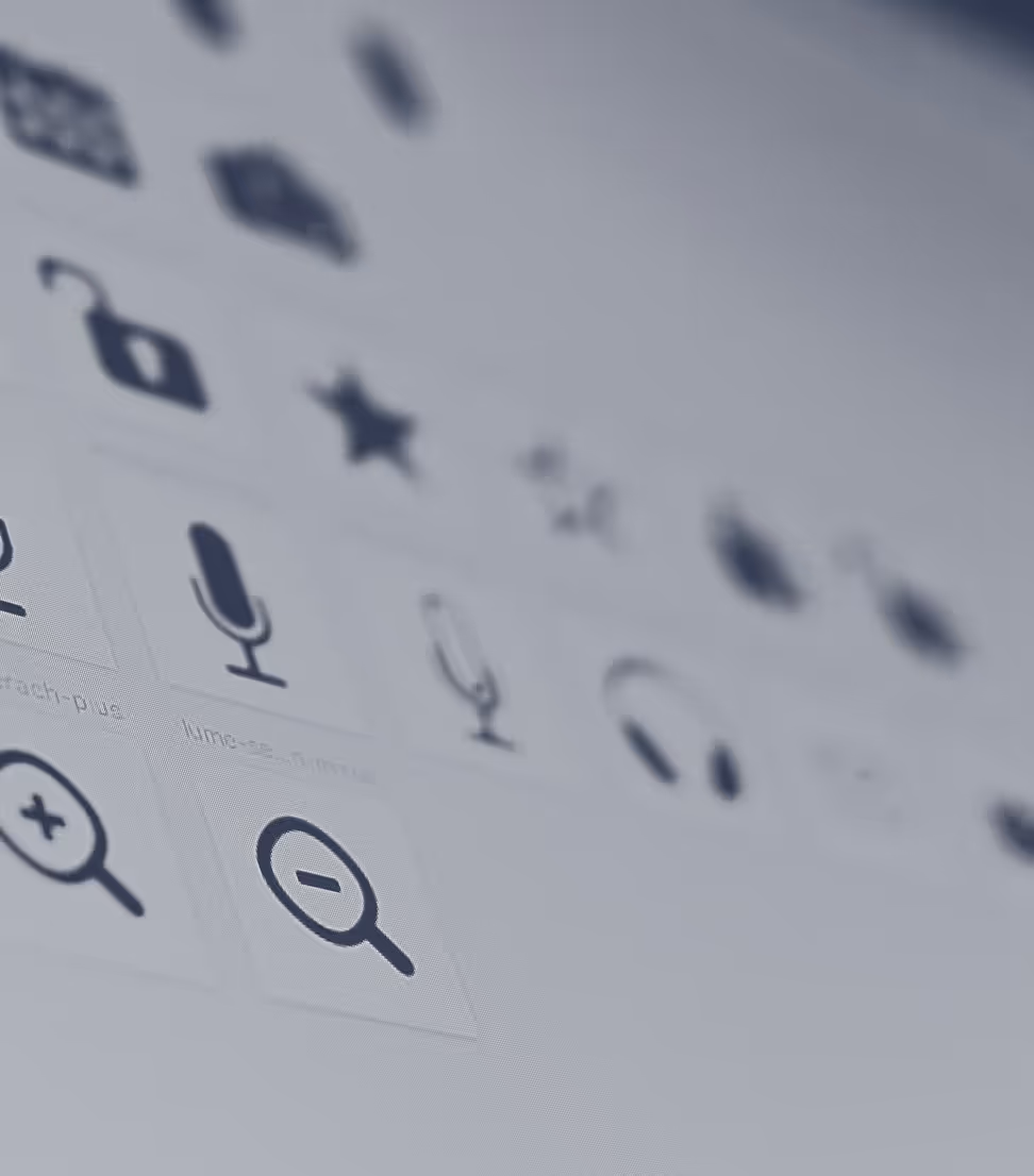 Close-up of various black user interface icons on a gray screen including microphone, lock, star, and zoom symbols.